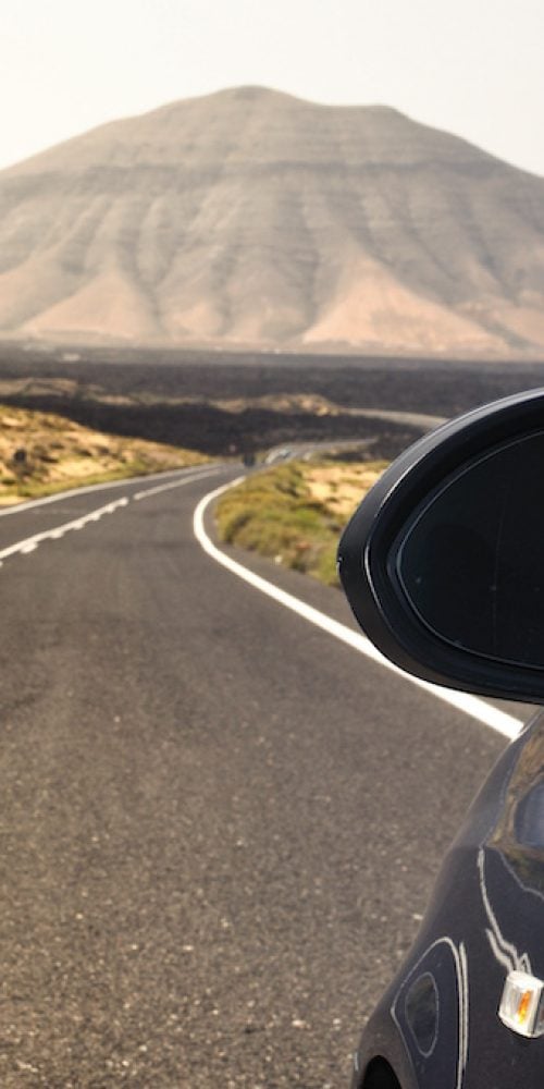 Road in mountains with car.